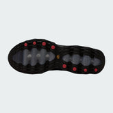 View of the outsole of the Nike Air Max DN Men's black running shoes, showing the durable rubber tread pattern and the unique design of the visible Dynamic Air pods.